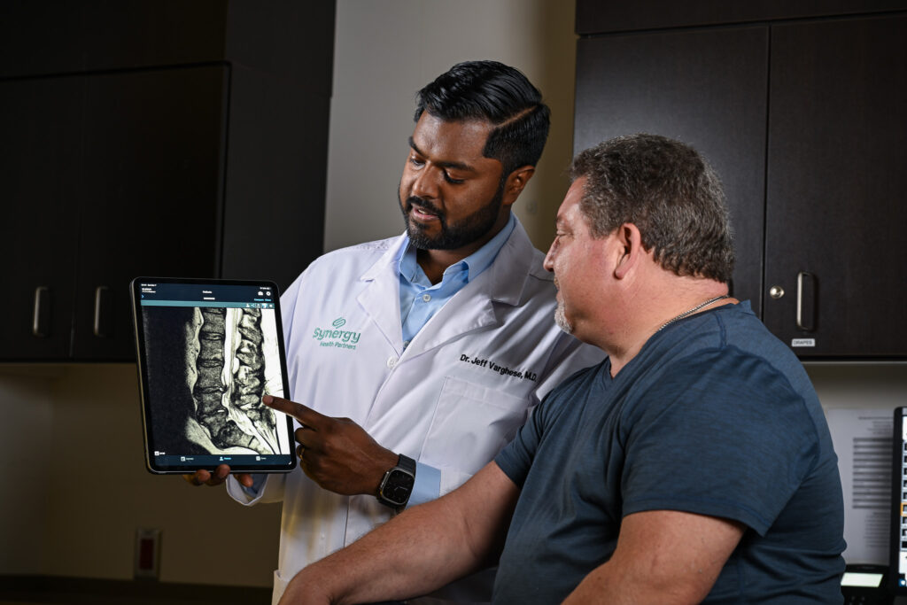 Dr. Jeff Varghese with patient